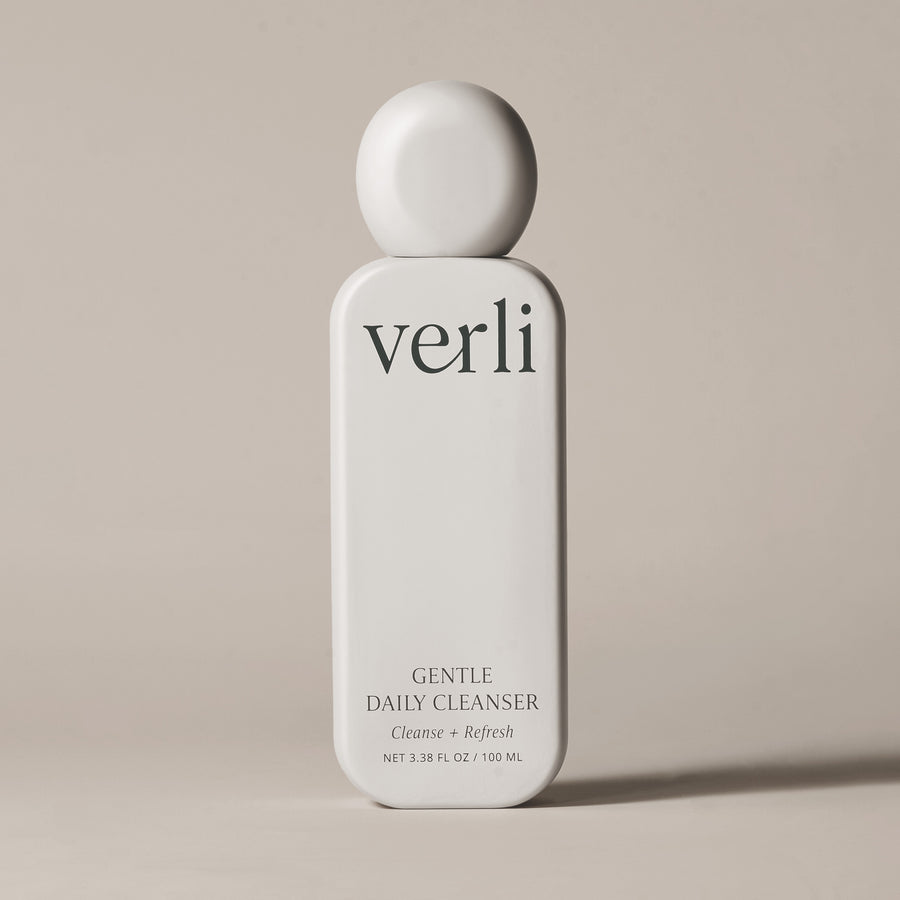Verli Gentle Daily Cleanser bottle on a beige background