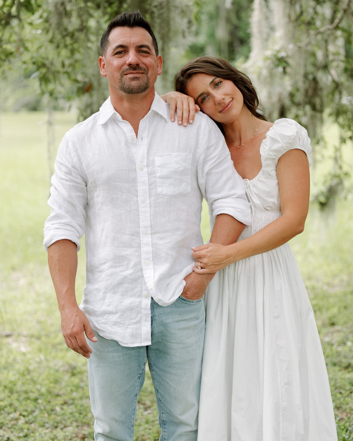 Marky and Laura standing together in a natural setting