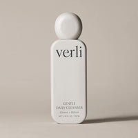 Verli Gentle Daily Cleanser bottle on a beige background
