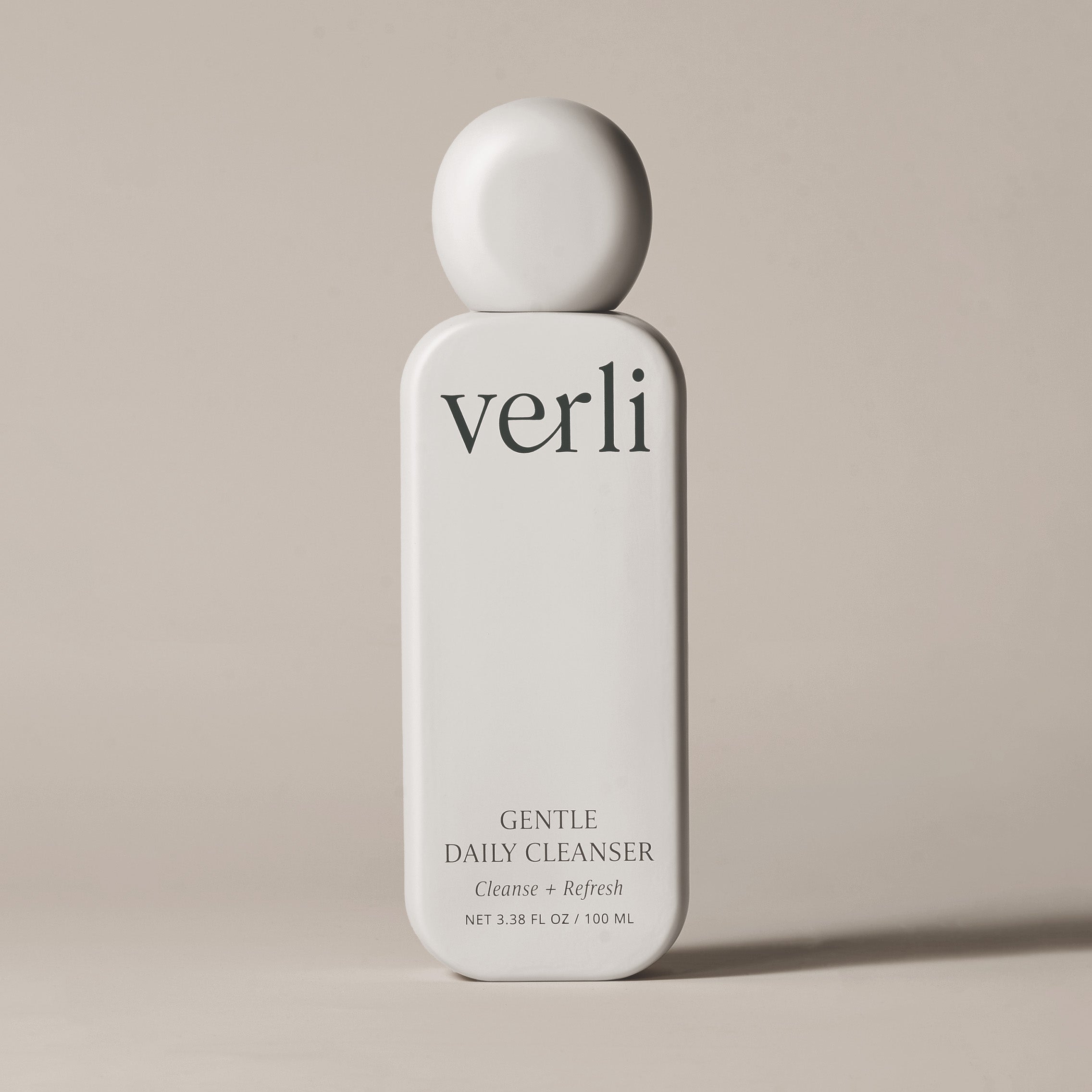 Verli Gentle Daily Cleanser bottle on a beige background