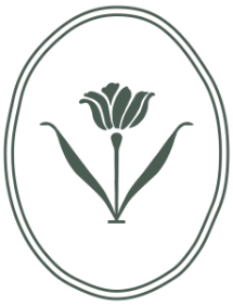 Decorative emblem with a stylized flower design in an oval frame.